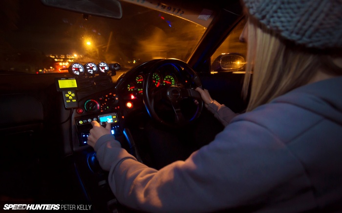 Mazda RX-7 interior with driver at night