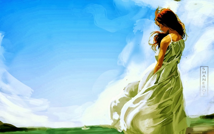 Woman in a flowing dress against a blue sky