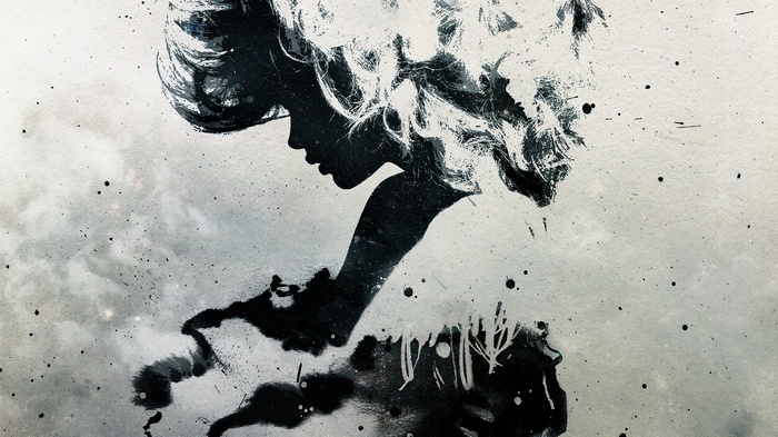 Silhouette of a woman with flowing hair