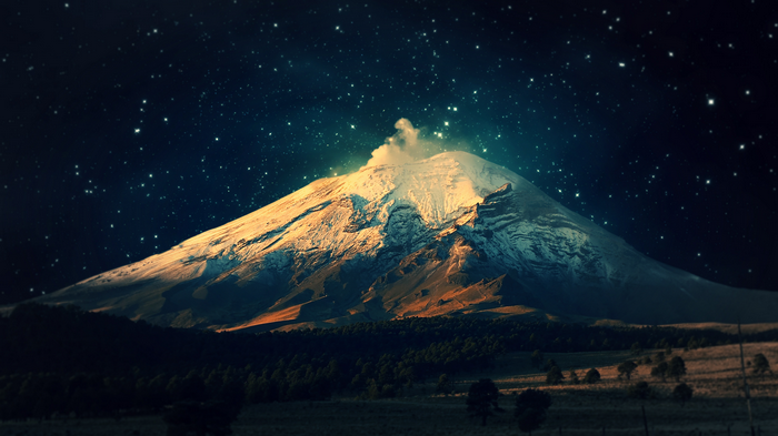 Snow-capped volcano under a starry night sky
