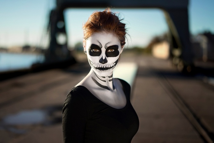Woman with skeleton makeup and black top