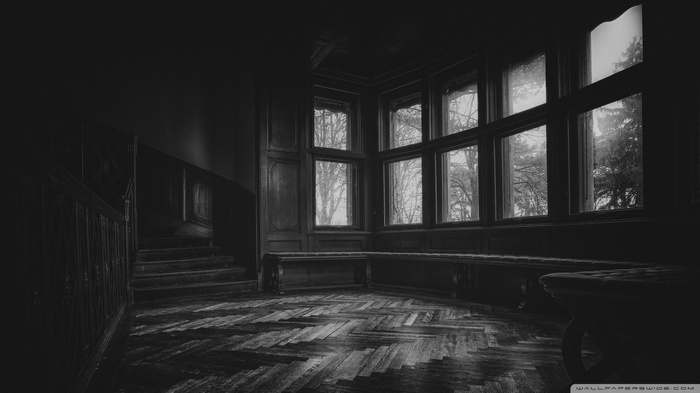 Monochrome room with stairs and large windows