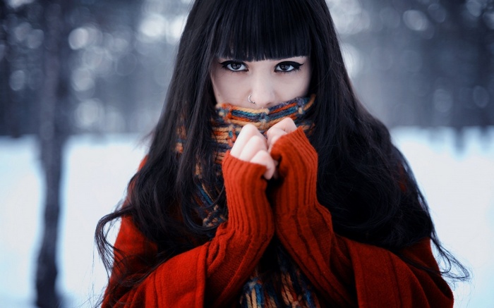 Woman in red sweater and scarf in winter