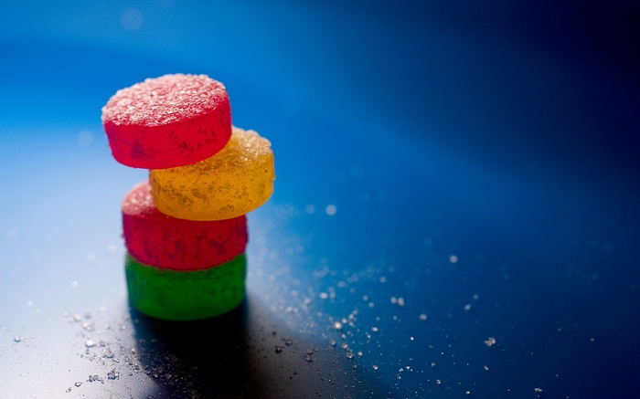 Stack of colorful gummy candies covered in sugar