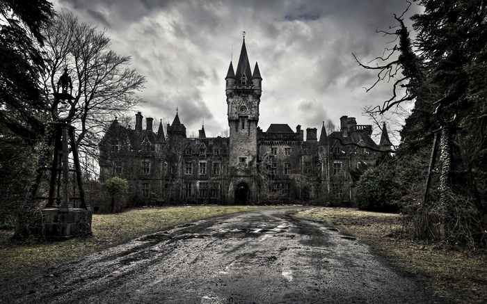 Abandoned castle with a dark, cloudy sky