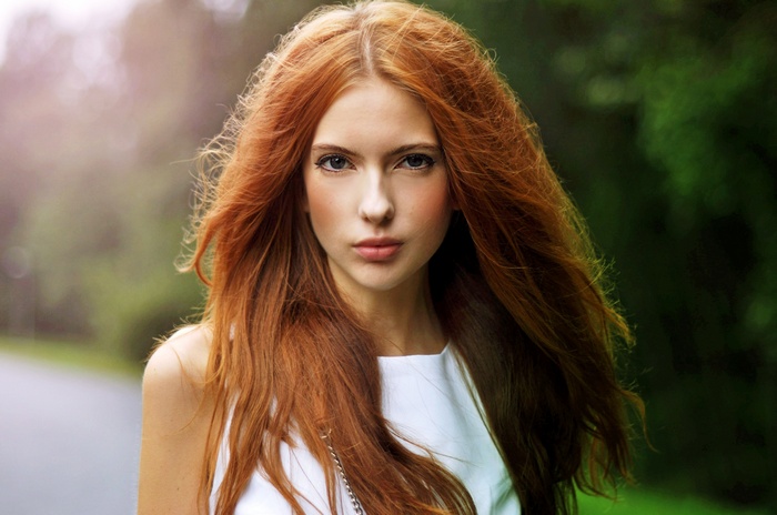 Ebba Zingmark with long red hair outdoors