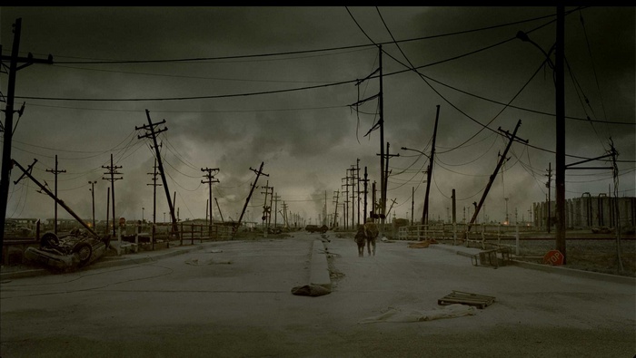 The Road (Movie) apocalyptic wasteland with people and overturned car