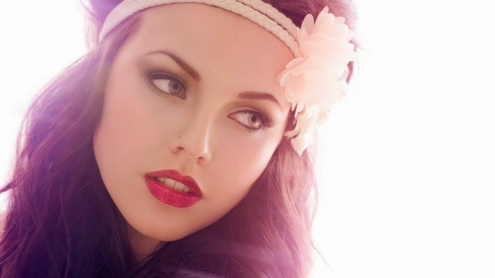 Woman with red lipstick and flower headband