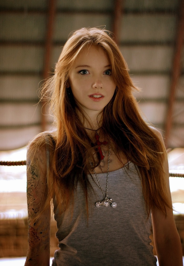 Olesya Kharitonova Redhead Model Portrait Cross Necklace Tattoo