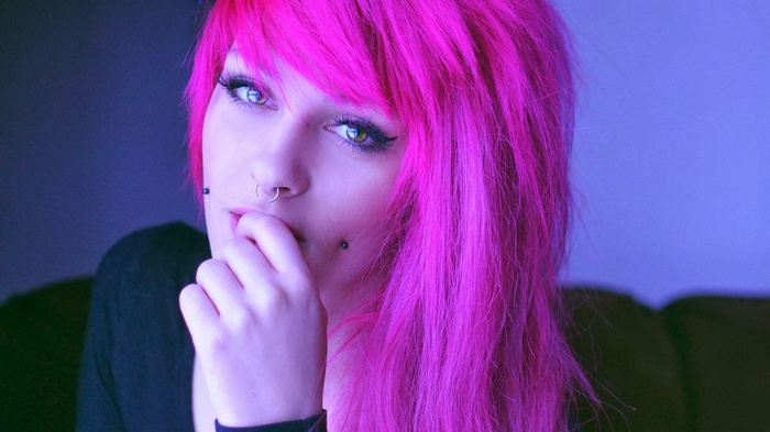 Woman with pink hair and piercings