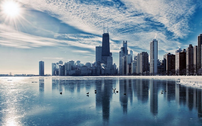 Chicago cityscape with frozen lake and sun