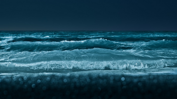 Dark ocean waves at night