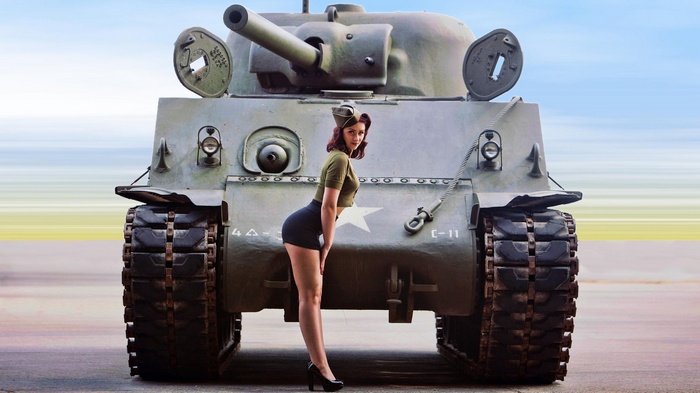 Woman in pinup attire posing with M4 Sherman tank