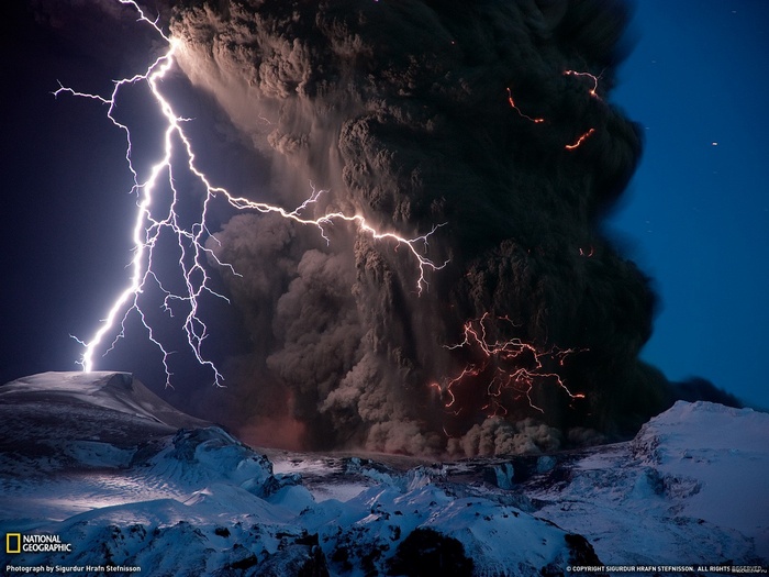 Volcanic eruption with lightning strikes