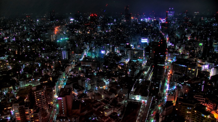 Nighttime cityscape of Tokyo with illuminated buildings