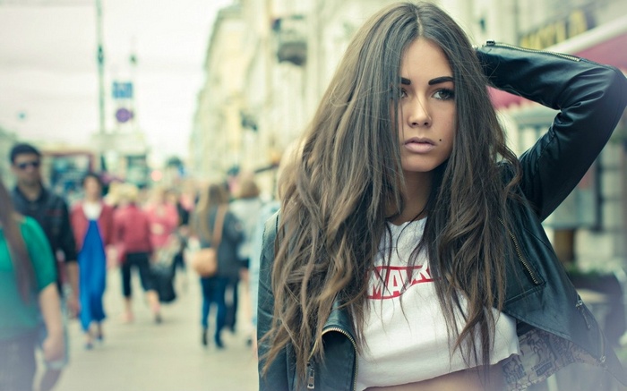 Diana Melison in a leather jacket on a city street