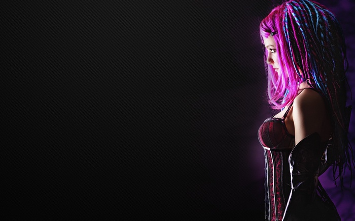 Woman with pink and blue dreadlocks in corset