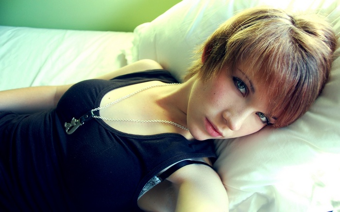 Woman with short hair wearing a necklace