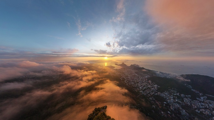 Aerial view of Rio de Janeiro at sunrise over clouds