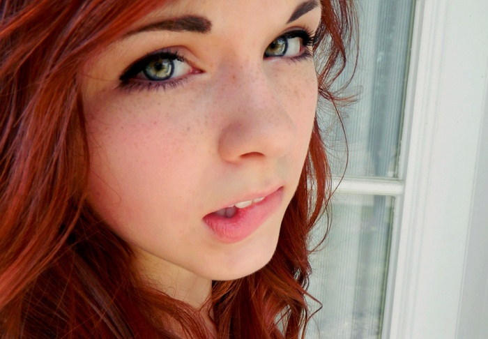 Claire Monnier with red hair and freckles