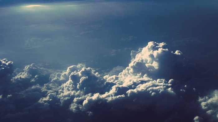 Dramatic clouds illuminated by sunlight from above