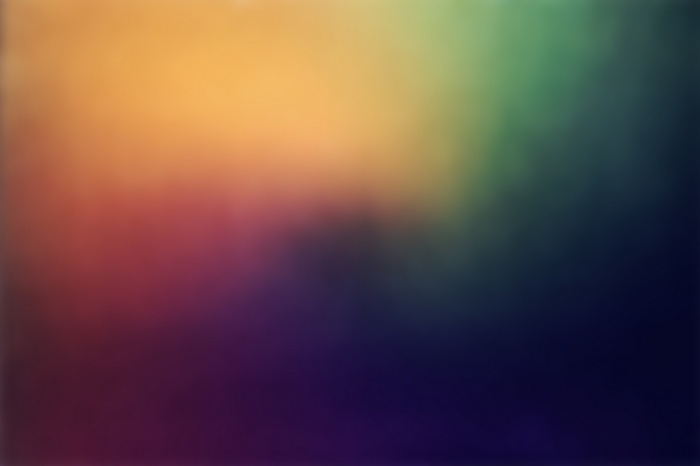 Abstract gradient with orange, red, green, and purple hues