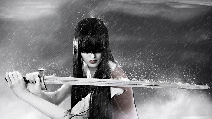 Woman with sword in the rain