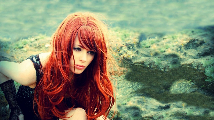 Redhead woman with long hair outdoors