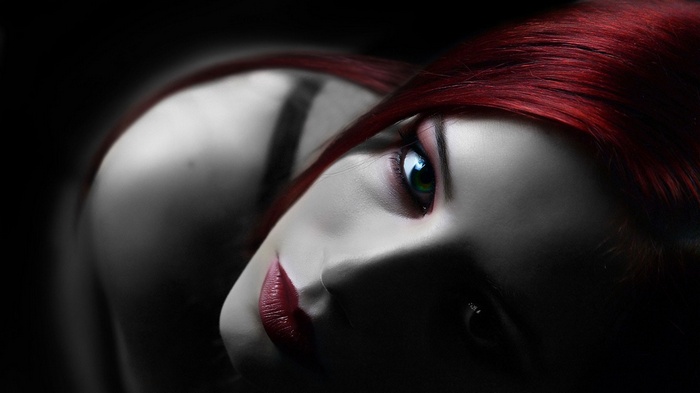 Redhead woman with green eyes and makeup
