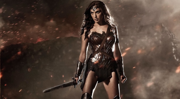 Wonder Woman holding a sword in a battle scene