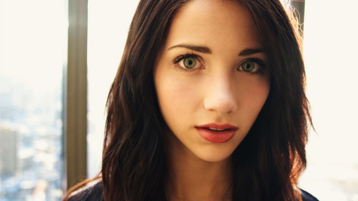 Emily Rudd with green eyes and red lipstick