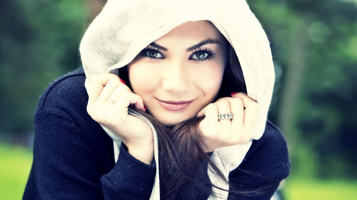 Georgeta wearing a hooded sweater outdoors