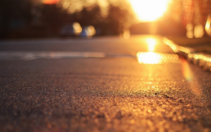 Road with bokeh and sunlight