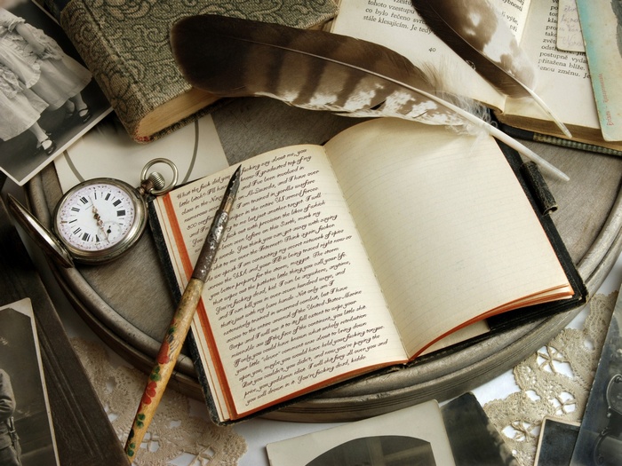 Journal with feathers and pocket watch