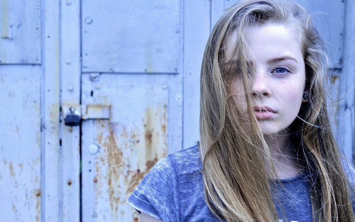 Portrait of a young woman with blue eyes