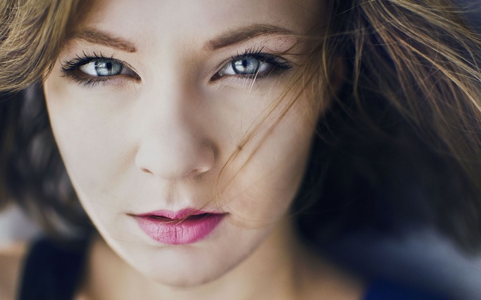 Close-up portrait of a woman with blue eyes