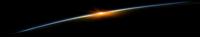 Sunrise over planet from space