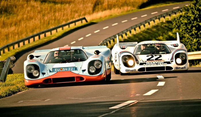 Porsche 917 cars on a race track