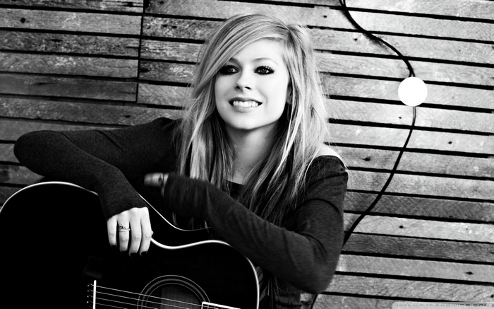 Avril Lavigne with a guitar
