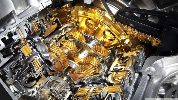 Cutaway view of a gold and silver automatic transmission gearbox