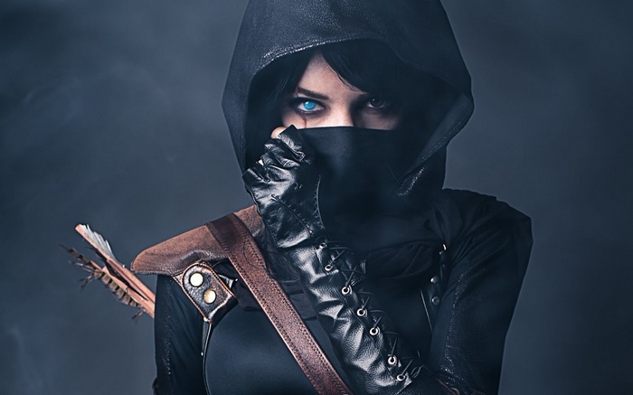Lyz Brickley as a female thief with blue eyes and a hood