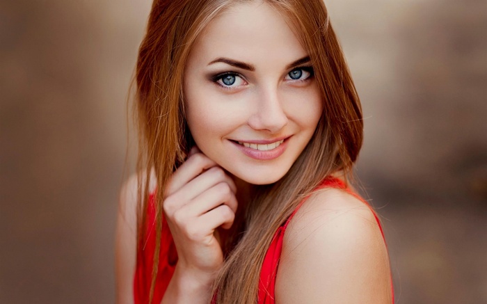 Woman with blue eyes and red dress