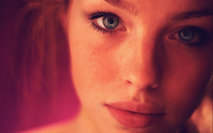Close-up portrait of a woman with blue eyes