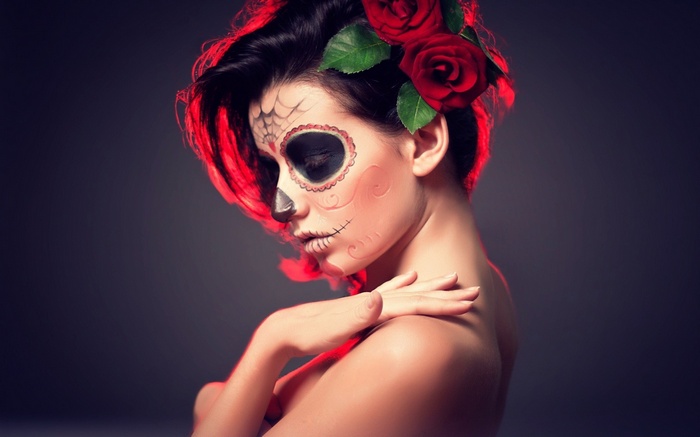 Woman with Sugar Skull makeup and roses in hair