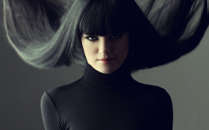 Jessie J with long black hair and bangs