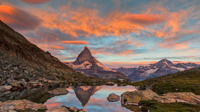 Matterhorn mountain reflected in a lake at sunset