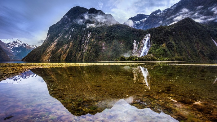 Milford Sound mountains and lake reflection