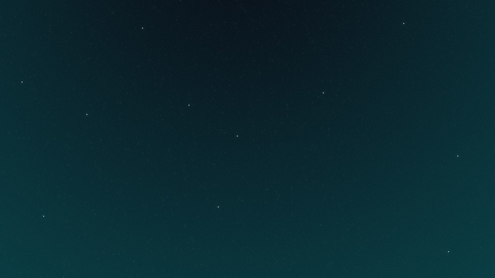 A dark night sky filled with stars