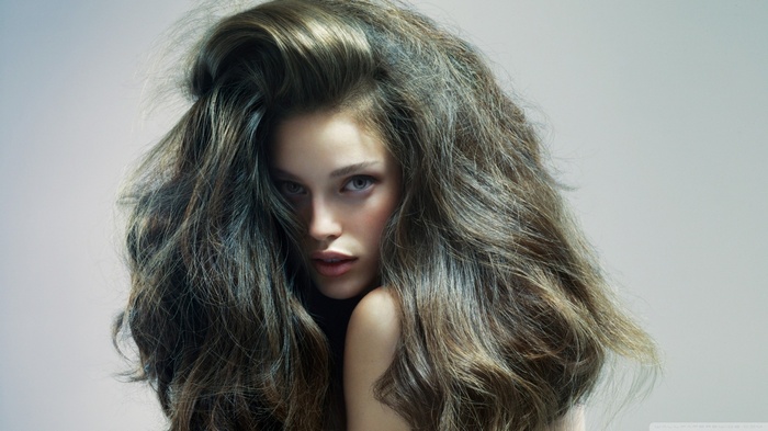 Brunette woman with messy long hair portrait