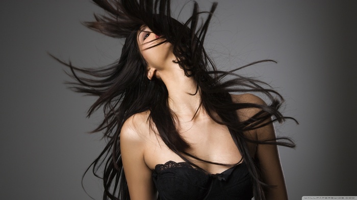 Woman with long dark hair in her face